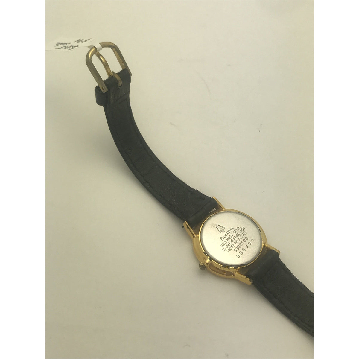 Bulova Ladies Longchamp Quartz White Dial Black Leather Strap Watch 056407